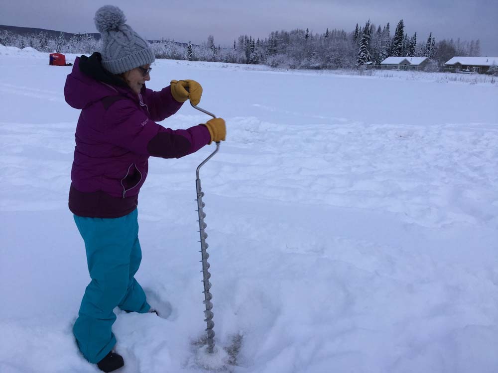 Dawn Pomrening, Sidney Huntington School, Galena, Alaska, measures ice thickness with the Fresh Eyes on Ice project. This is an example of engaging local observers in collecting data that are of value to a broad array of scientific and forecasting applications while also integrating STEM education into the research process.